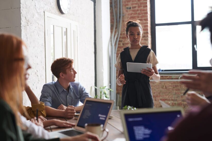 a project manager presenting in a meeting